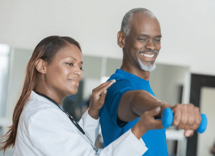 Man getting assistance with his daily physical therapy, a Chandler, AZ senior